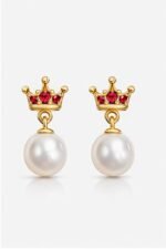 Elegant pearl earrings with gold crown and red gemstone accents for children. Perfect for special oc.