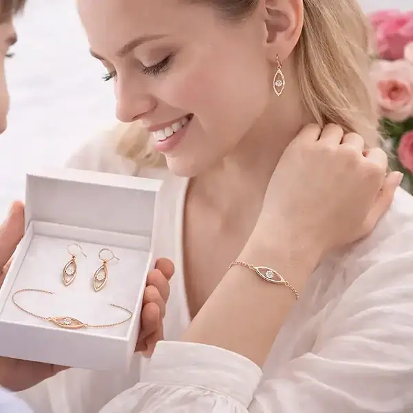 Sterling silver jewelry set including earrings, bracelet, and necklace in a gift box.